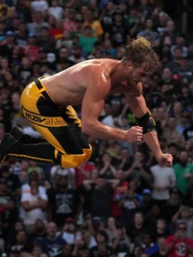 Watch as Logan Paul skies high for frog splash on The Miz through announce table at WWE SummerSlam